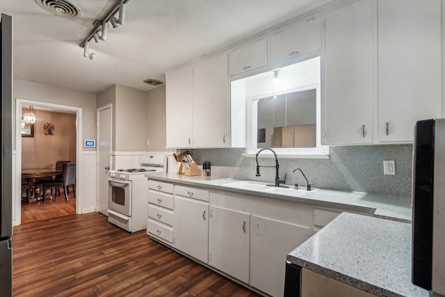 kitchen with dark wood-type flooring, white cabinetry, sink, and white range with gas stovetop