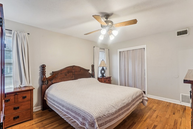 bedroom with hardwood / wood-style floors and ceiling fan