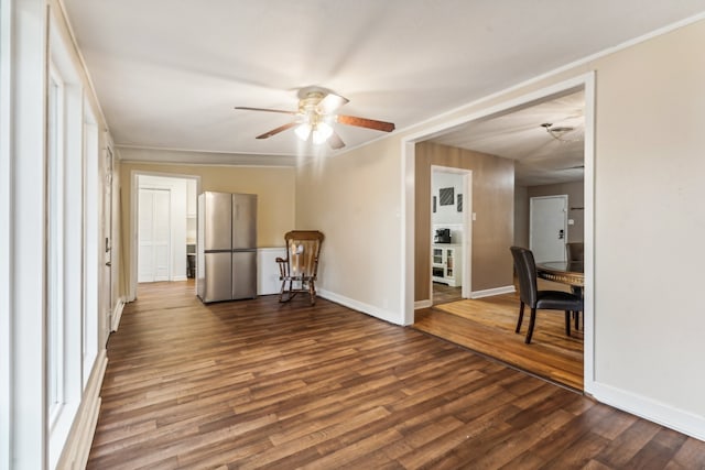 unfurnished room with ceiling fan, crown molding, and wood-type flooring