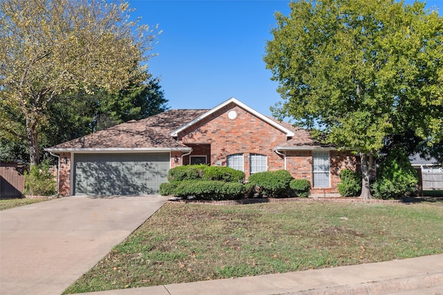 ranch-style house featuring a garage and a front lawn