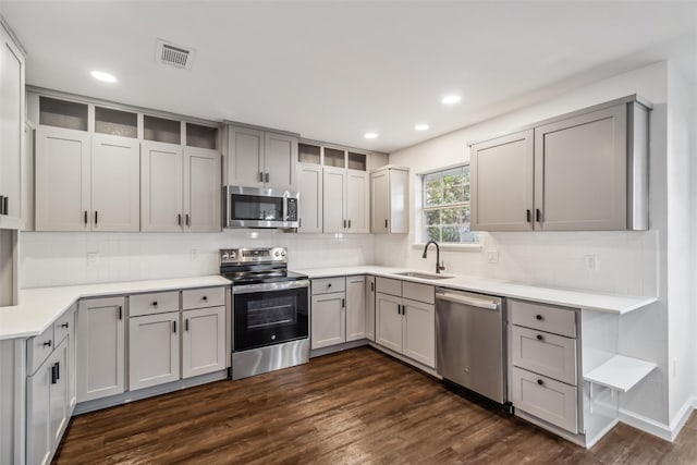 kitchen featuring gray cabinetry, sink, and stainless steel appliances