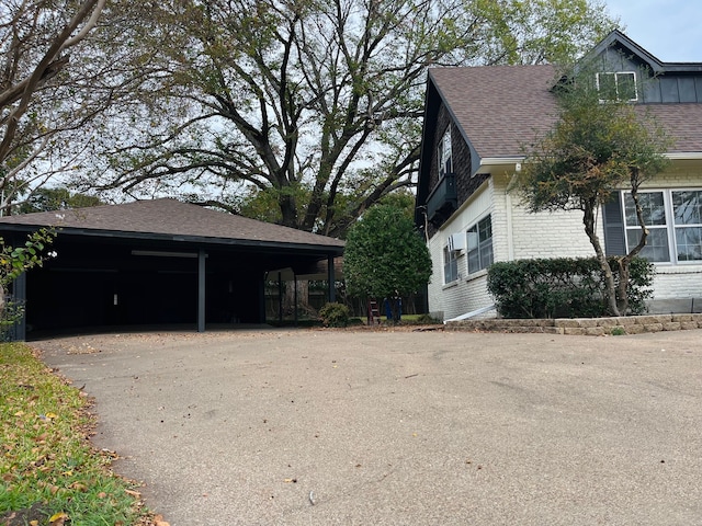 view of property exterior with a carport