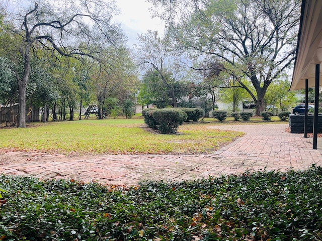 surrounding community featuring a patio and a yard