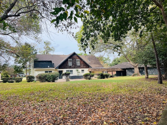 rear view of property with a yard