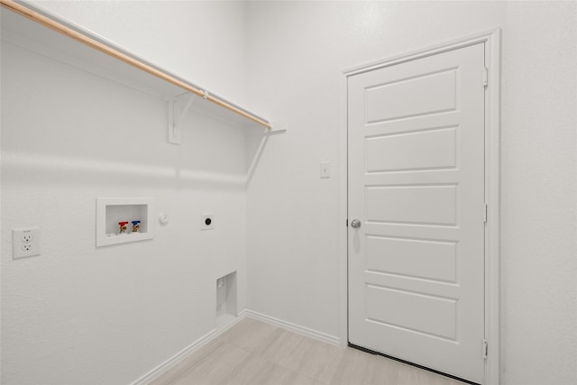 clothes washing area featuring hookup for an electric dryer, gas dryer hookup, and hookup for a washing machine