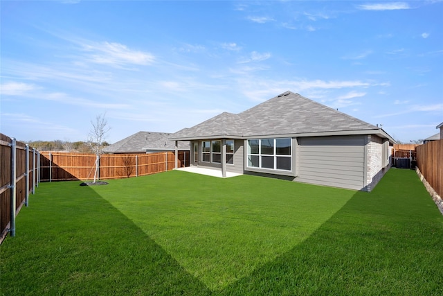 rear view of property with cooling unit, a yard, and a patio area