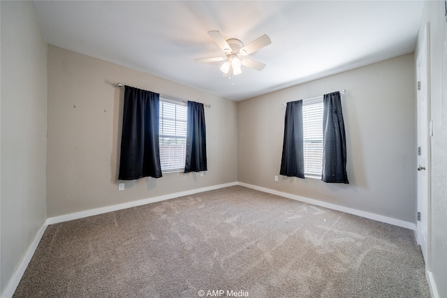 unfurnished room with carpet flooring and ceiling fan