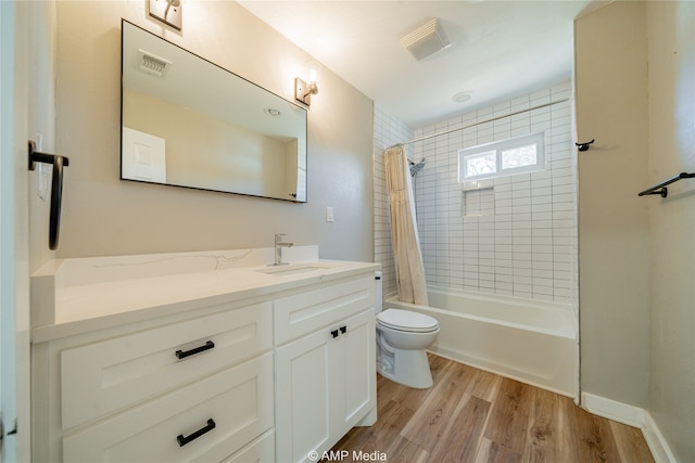 full bathroom with shower / tub combo with curtain, vanity, wood-type flooring, and toilet