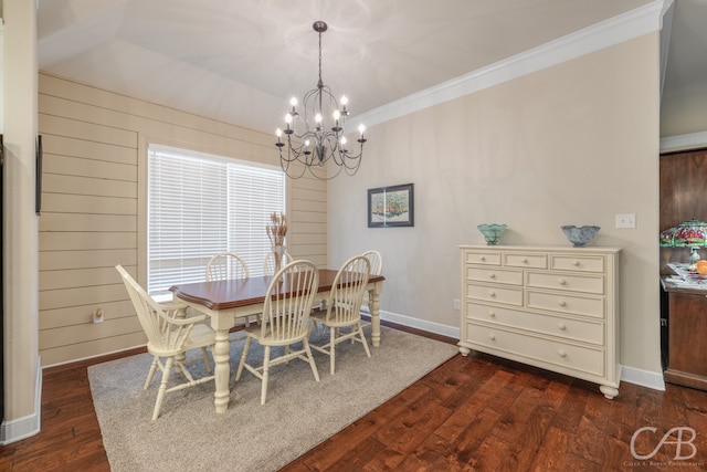 dining space with a notable chandelier, wood walls, dark hardwood / wood-style flooring, and crown molding