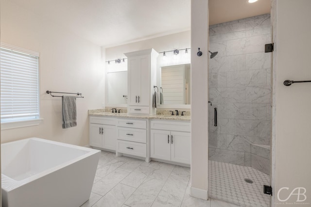 bathroom featuring vanity and separate shower and tub