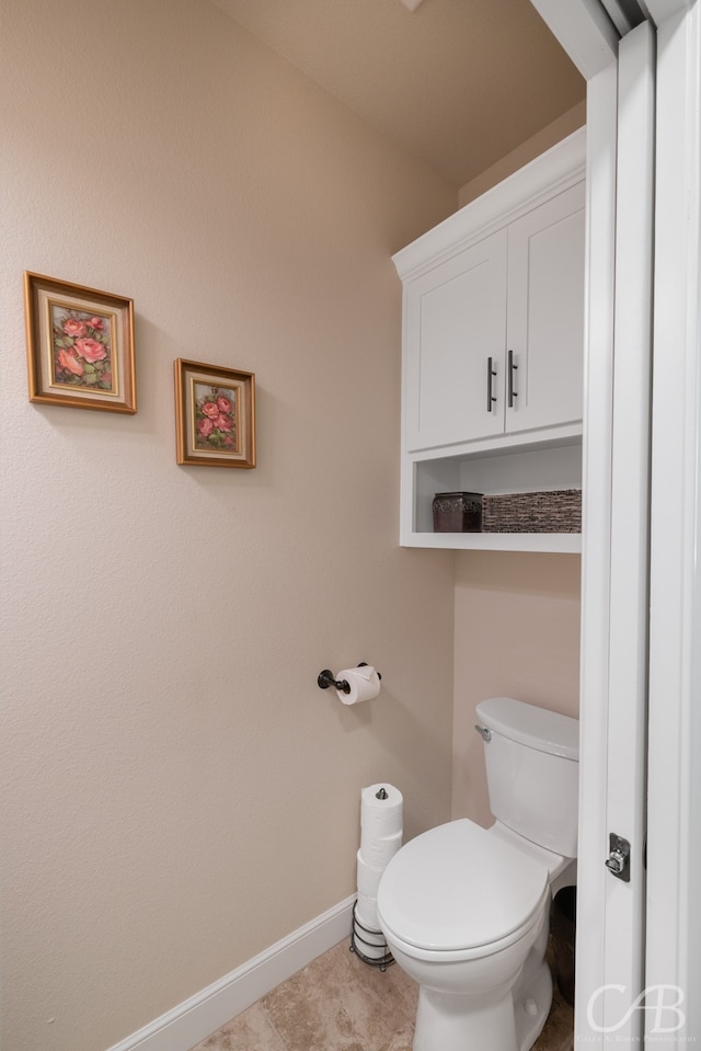 bathroom featuring tile patterned floors and toilet