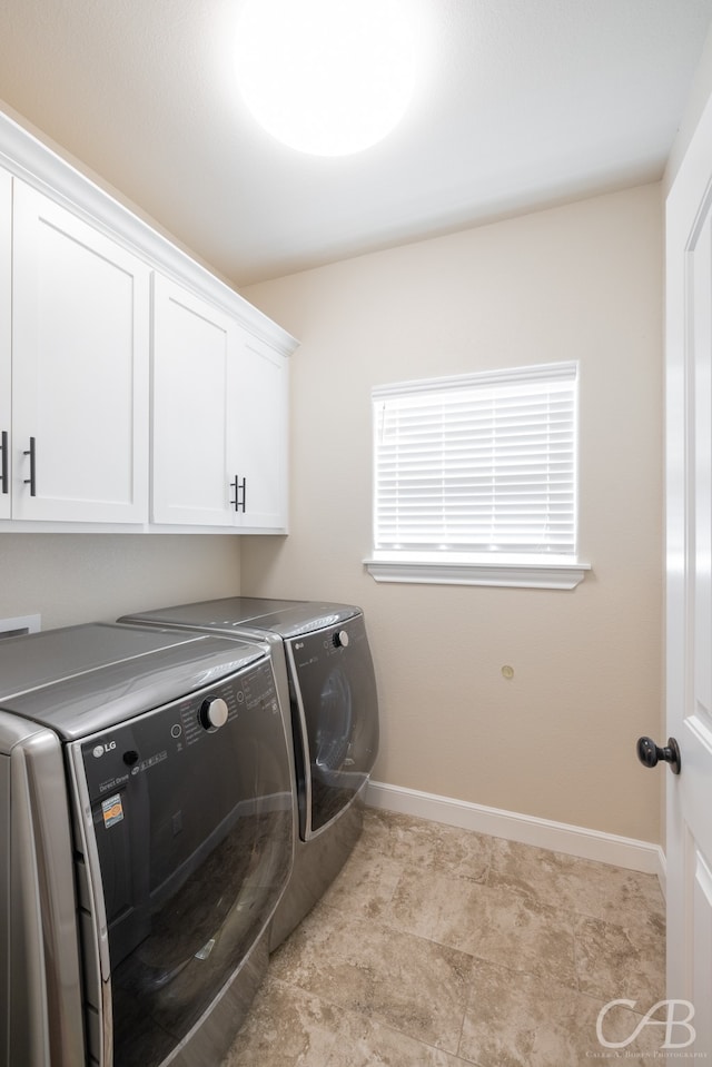 laundry room with cabinets and independent washer and dryer