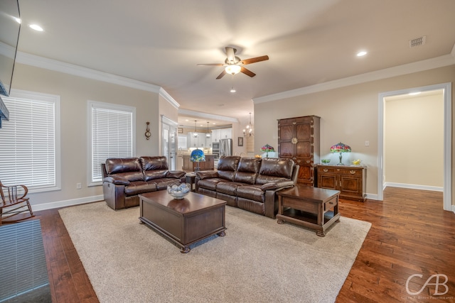 living room with ceiling fan, dark hardwood / wood-style flooring, and ornamental molding