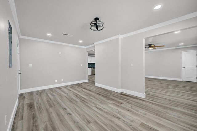 living room featuring ornamental molding, ceiling fan, and light hardwood / wood-style flooring