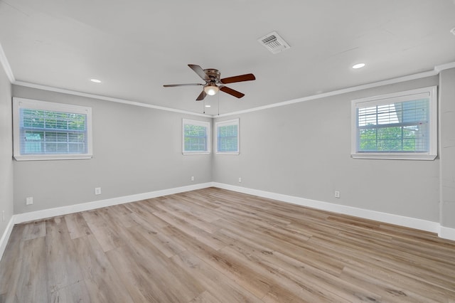 unfurnished room featuring ceiling fan, light hardwood / wood-style flooring, and ornamental molding