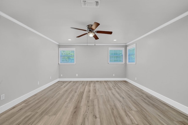 unfurnished room featuring ceiling fan, ornamental molding, and light hardwood / wood-style floors