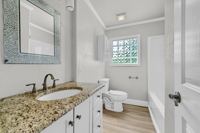 full bathroom featuring crown molding, hardwood / wood-style floors, toilet, shower / tub combination, and vanity