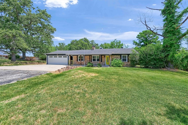 single story home with a front yard and a garage