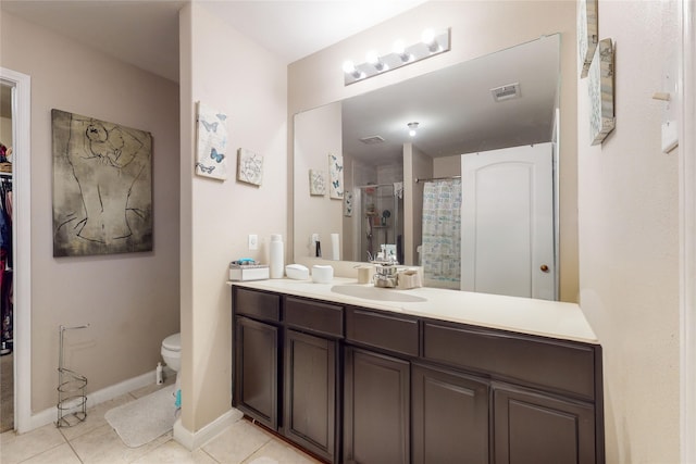 bathroom with vanity, a shower with shower curtain, toilet, and tile patterned flooring