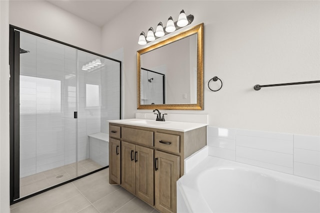 bathroom featuring vanity, tile patterned floors, and separate shower and tub