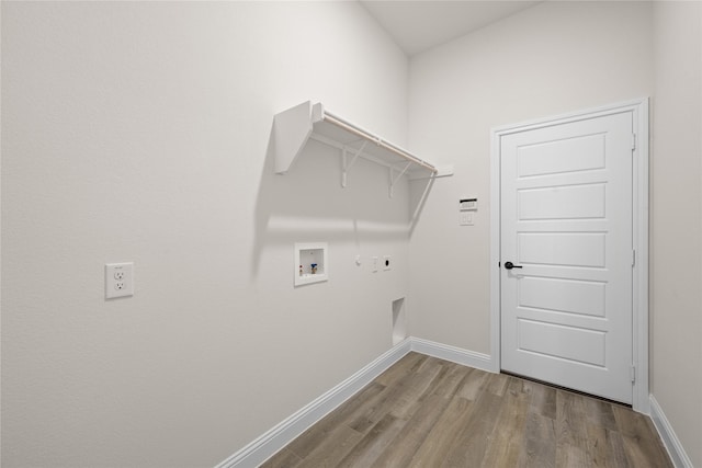 washroom featuring hookup for a washing machine, wood-type flooring, hookup for an electric dryer, and hookup for a gas dryer