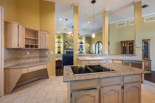 kitchen featuring black electric cooktop, hanging light fixtures, kitchen peninsula, sink, and ceiling fan