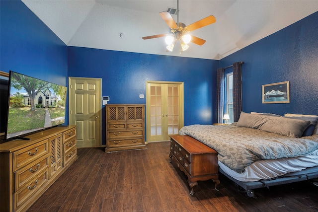 bedroom with lofted ceiling, ceiling fan, multiple windows, and dark hardwood / wood-style flooring