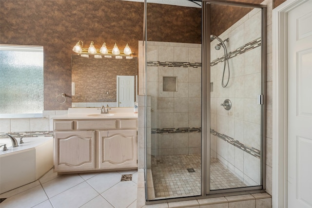 bathroom with vanity, independent shower and bath, and tile patterned floors