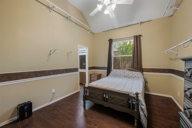 bedroom featuring dark hardwood / wood-style floors, vaulted ceiling, and ceiling fan