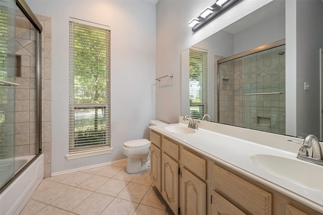 full bathroom with vanity, toilet, and a wealth of natural light