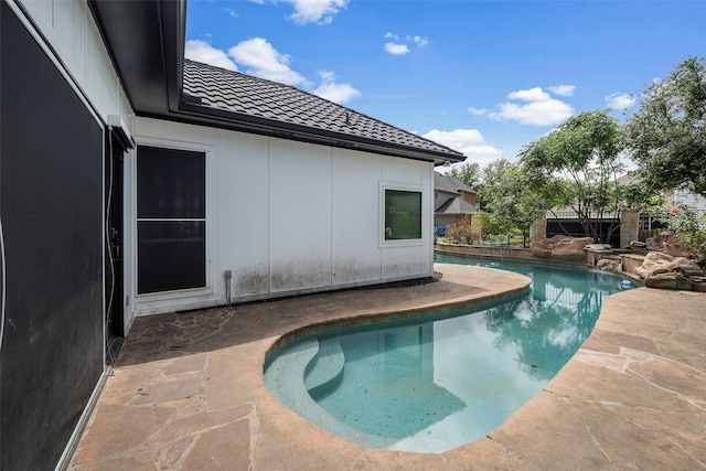 view of swimming pool with a patio