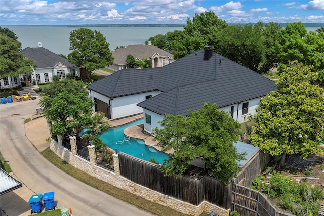 birds eye view of property with a water view