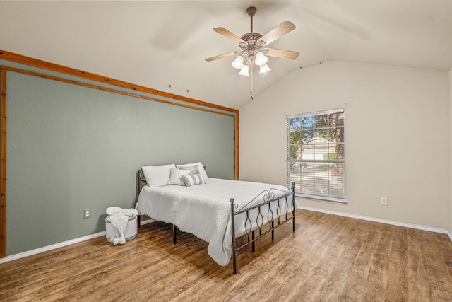 bedroom featuring vaulted ceiling, hardwood / wood-style flooring, and ceiling fan