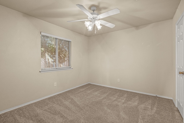 empty room with ceiling fan and carpet flooring