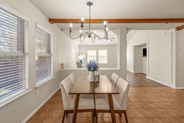 dining area with beamed ceiling, a chandelier, and tile patterned floors