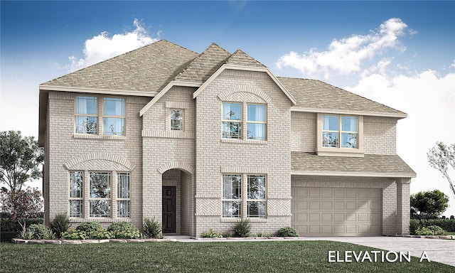 view of front of property featuring a front yard and a garage