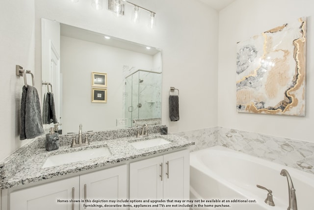 bathroom with vanity and independent shower and bath