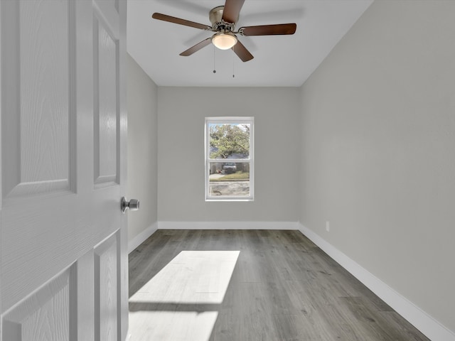 unfurnished room featuring light wood-type flooring and ceiling fan