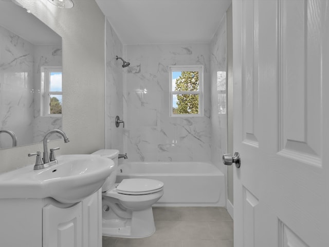 full bathroom featuring vanity, tiled shower / bath combo, toilet, and tile patterned floors