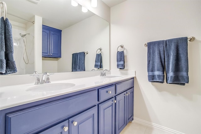 bathroom featuring a shower, vanity, and tile patterned floors