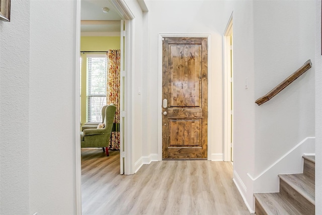 foyer with light hardwood / wood-style floors