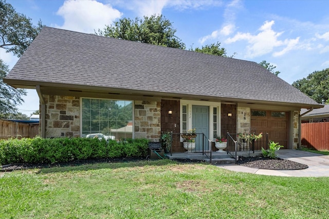 view of front facade featuring a garage and a front yard