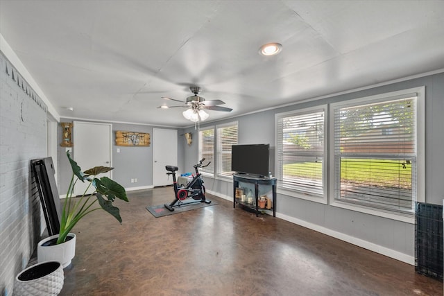 exercise area with a wealth of natural light and ceiling fan