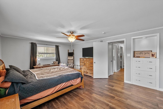 bedroom with ceiling fan, wood-type flooring, and ornamental molding