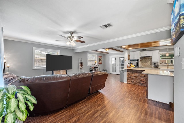 living room with french doors, ceiling fan, ornamental molding, and dark wood-type flooring