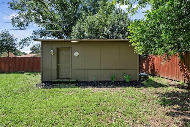 view of outdoor structure with a yard