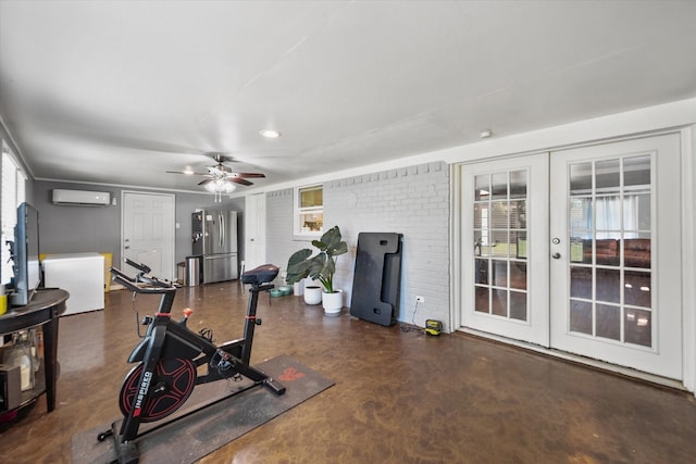 workout area with a wall mounted air conditioner, french doors, ceiling fan, and brick wall