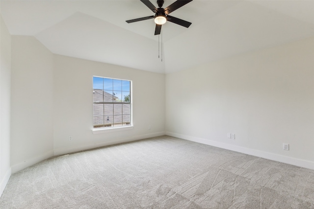 carpeted empty room featuring lofted ceiling and ceiling fan