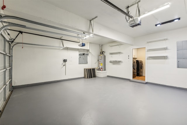 garage with a garage door opener, gas water heater, and independent washer and dryer