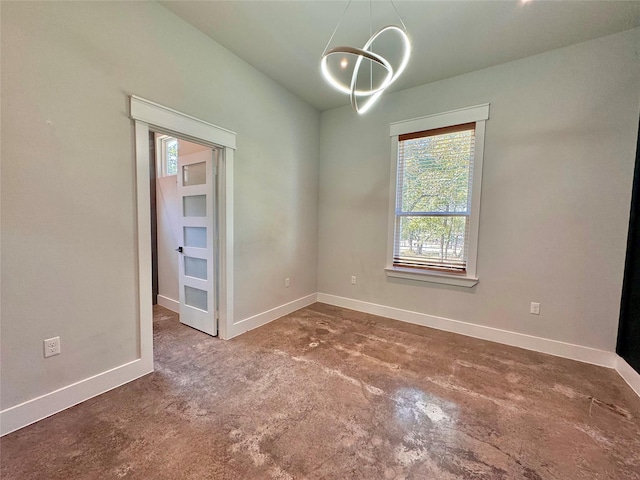 166 Oak Ridge Loop, Whitney, TX 76692 - empty room featuring a chandelier and baseboards